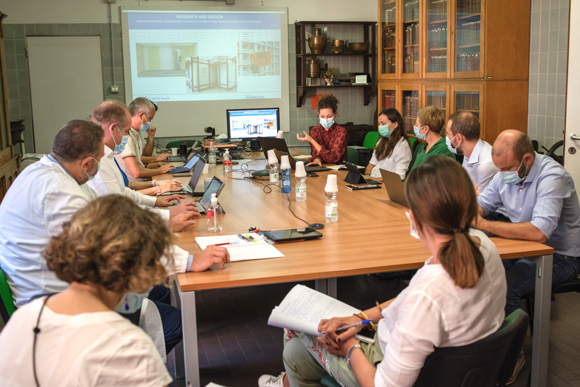 17 September 2020: Architect and WHO Consultant Anna Silenzi (centre, wearing red) and Engineer and WHO Hospital Readiness Consultant Anja Borojevic (sitting to Anna’s left) give a presentation during a meeting about “hospitals of the future.”
