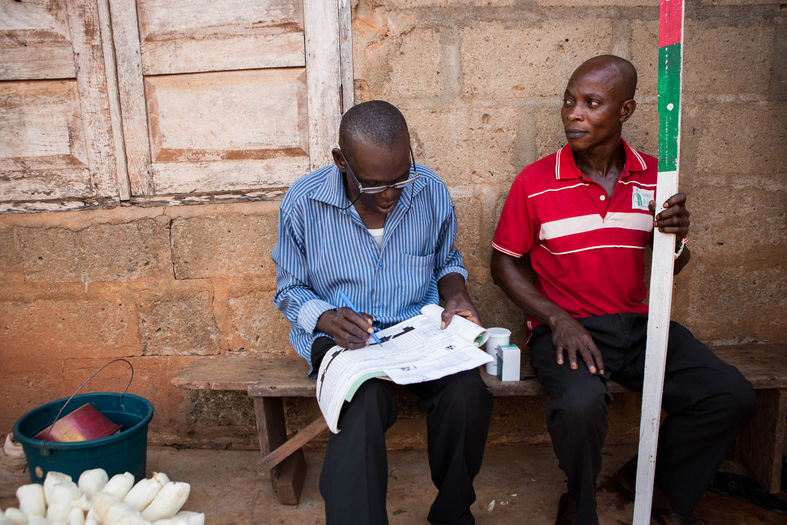 Ademocha and Aidika administer medicine to prevent and treat lymphatic filariasis in Cross River State, Nigeria.
